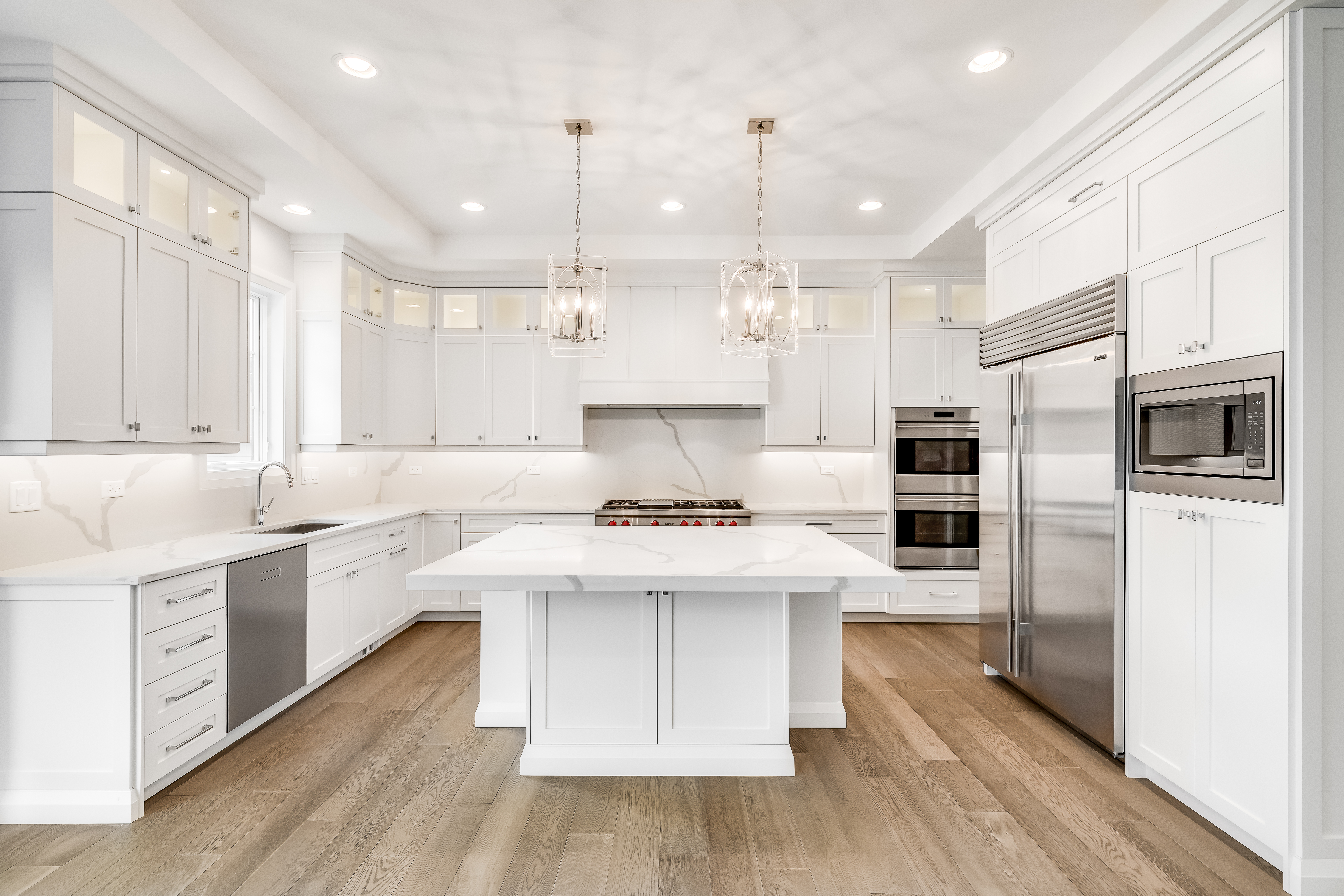 Inviting Kitchen With Off White Cabinets